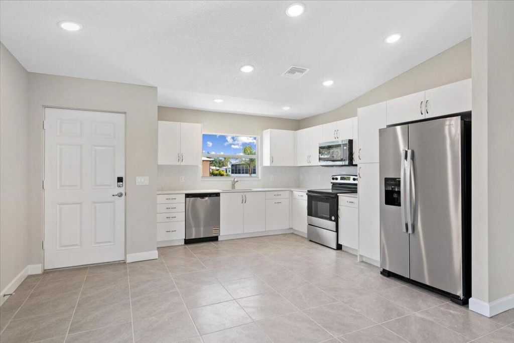 Photo of 15 Jacaranda Lane, Port Saint Lucie, FL 34952 (MLS # R11090483)