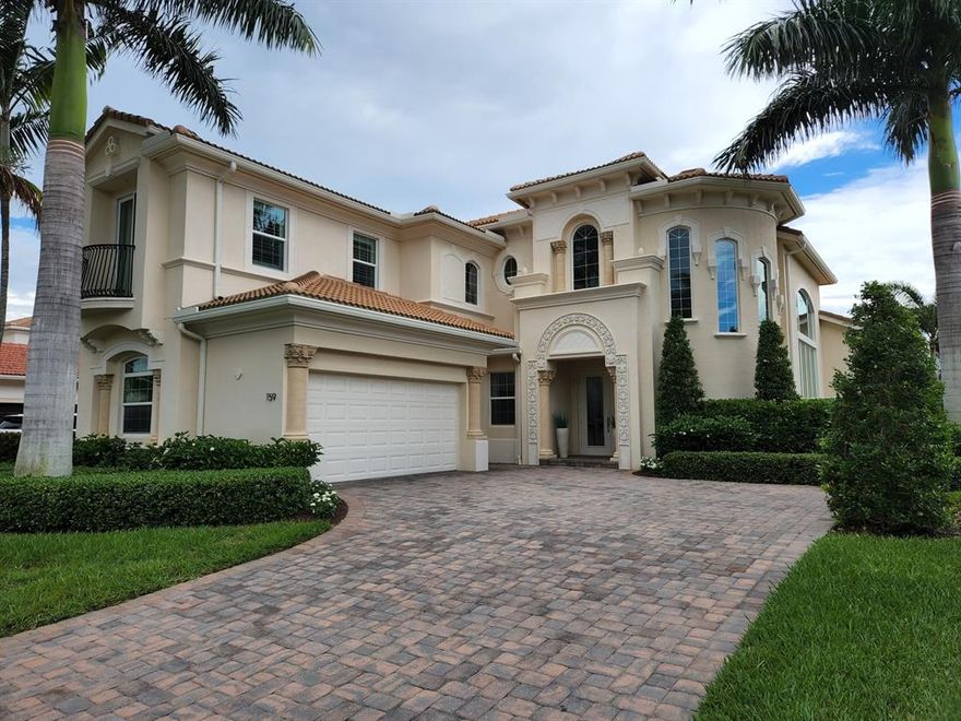 JUPITER COUNTRY CLUB MODEL HOME  - ALL TURNKEY FURNISHINGS INCLUDED - 5 YEARS OLD. Located on the 3rd hole with a beautiful water view, preserve stand and overlooking the 3rd fairway, this 4 bedroom/4.5 bath with Den is the perfect Stay at Home - Work at Home winter retreat or permanent residence.  A private, beautifully landscaped property with a pool, raceway/jet fountains and a jacuzzi spa complete the property.  Special features include White Gourmet Kitchen and HIs/Hers  Closets.  Amenities at Jupiter CC include golf, tennis, fitness/spa,  and 2 dining venues.  A golf membership is attached to this residence - play golf and enjoy the club amenities with no wait list required!  A unique opportunity to have a professional designed, turnkey home by Design Guild Interiors of Jupiter