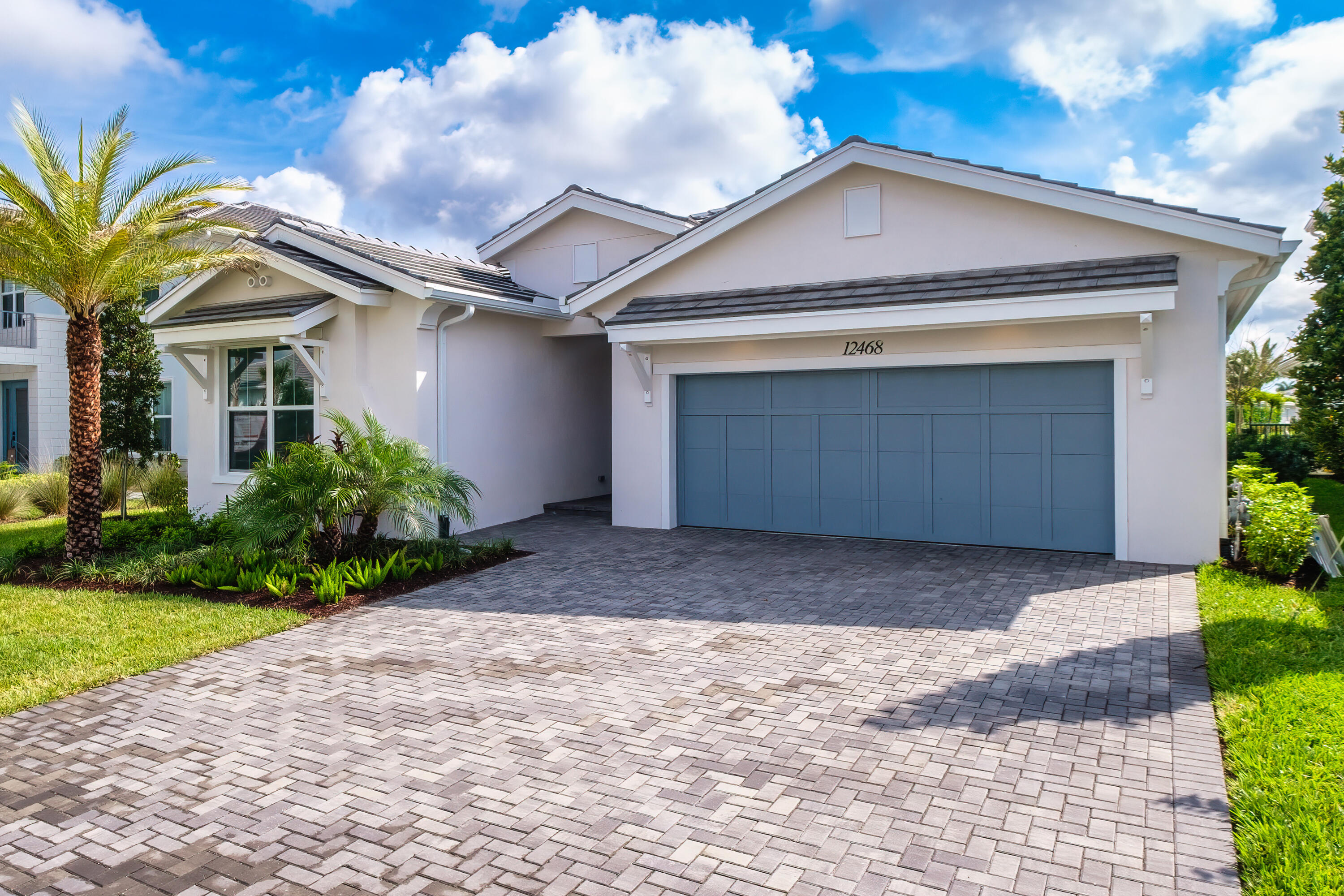 Located within the new master planned community of Avenir, this recently constructed Toll Brothers 4-bedroom home boasts numerous upgrades, including modern large-format high-gloss porcelain flooring throughout, 16' sliding doors for natural lighting, Kitchen-Aid appliances, and an expanded main bedroom retreat with a spa-styled bath. Open concept floorplan with lake views and impact glass. Use the flex space as a walk-in pantry or home study. Avenir includes a resort-style clubhouse for residents use and a planned town center. Experience what one of Gardens newest communities offers your lifestyle.