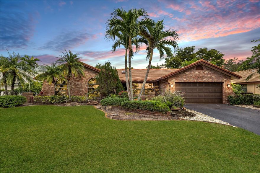 Best deal in town with adjusted price! Tucked away on a peaceful, tree-filled street, this residence is a haven for family living & relaxation. It features impact windows at the front & accordion shutters at the rear, ensuring both safety & privacy. The house boasts a fully screened-in pool & patio, alongside a secluded backyard, creating an idyllic park-like atmosphere. At its core is an open-plan kitchen & living space, perfect for hosting gatherings and spending quality time with family. The A/C 2-car garage offers versatile use, either as additional flexible space or as a conventional garage. Conveniently located near top-rated schools, parks, and dining, this splendid family home epitomizes the finest in suburban living.