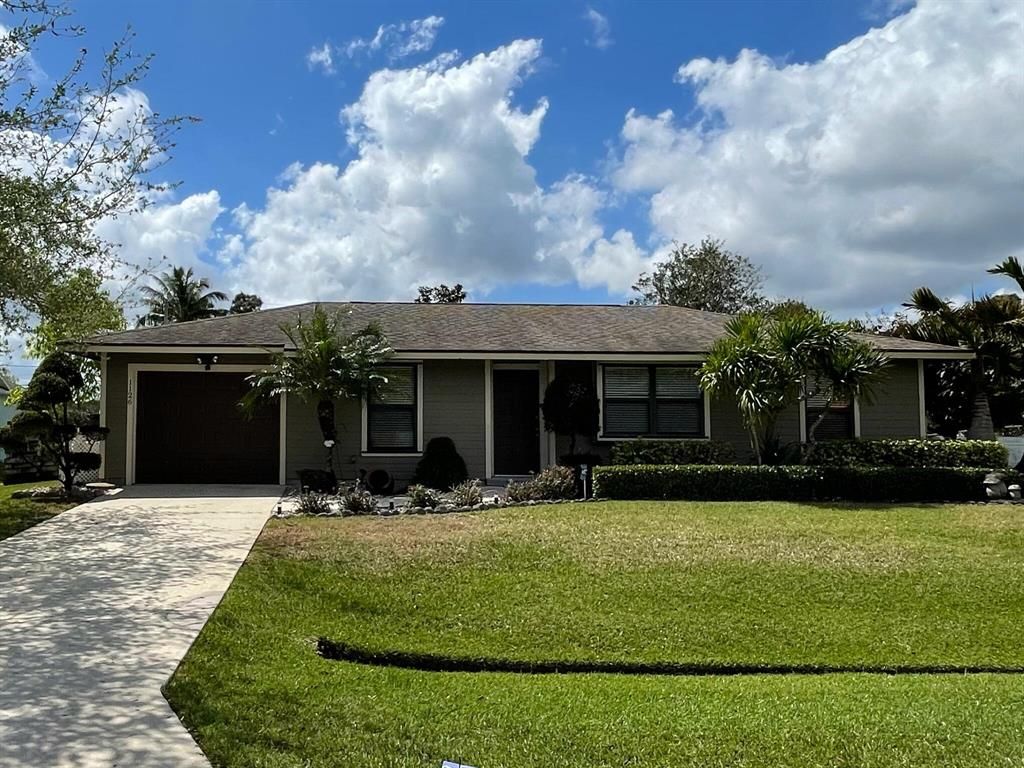 Photo of 1126 SW Colorado Avenue, Port Saint Lucie, FL 34953 (MLS # R10703667)