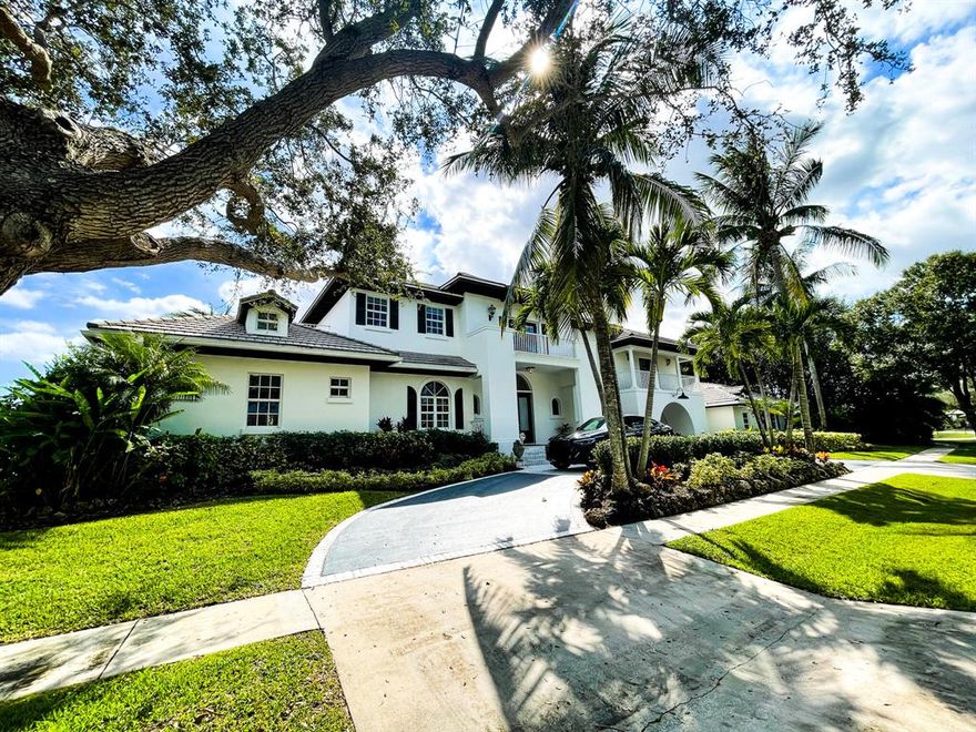 Elegant estate-sized home at Presidents Estates Gated Community, West Palm. Almost 6,000sf  inside with terraces off of all rooms. Many classy features including two fireplaces, copper chimneys, Brazilian mahogany floors, impact glass, spacious open kitchen with huge granite countertop, five-car garage, emergency generator, elevated concrete slab and covered steel beamed ceilings, newly polished granite floors on main level, huge master with his/her large bathrooms on first floor. Living large, lavish outdoors, prime features include being on lake side, private open-air pool/spa with scenic  views of lake and city, undisturbed meditation garden, and outside ceilings of cedar. Located just minutes to the outlet mall, PBI, WPB and beach, Membership in Banyan Cay private club will be include