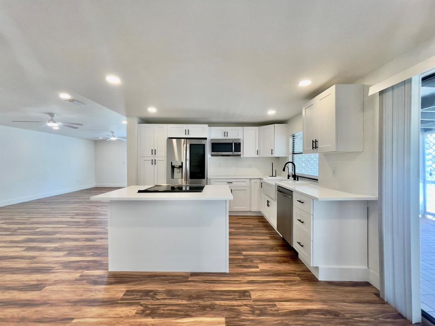 Financing Available! Wow, Completely remodeled home in the heart of Palm Beach Gardens. Brand New flooring, New real wood shaker soft-close kitchen cabinets, Stainless appliances & Quartz counters. Brand New roof 2025. Brand new electrical wiring & panel. New Drywall & insulation. Complete CPVC plumbing repipe. New water heater. High hat lighting & paddle fans. Two large bedrooms, stylish modern baths w/Marble tile & Jacuzzi tub. Huge covered patio area to relax & entertain. The Meadows is a terrific community with community pool, fitness center & boat,/Rv storage.  Maintenance fees include cable, water & property taxes. Fantastic location close to all the casual & fine restaurants and shopping along PGA Blvd & 10 minutes to the Beaches. Great Home, Perfect location, Terrific Value