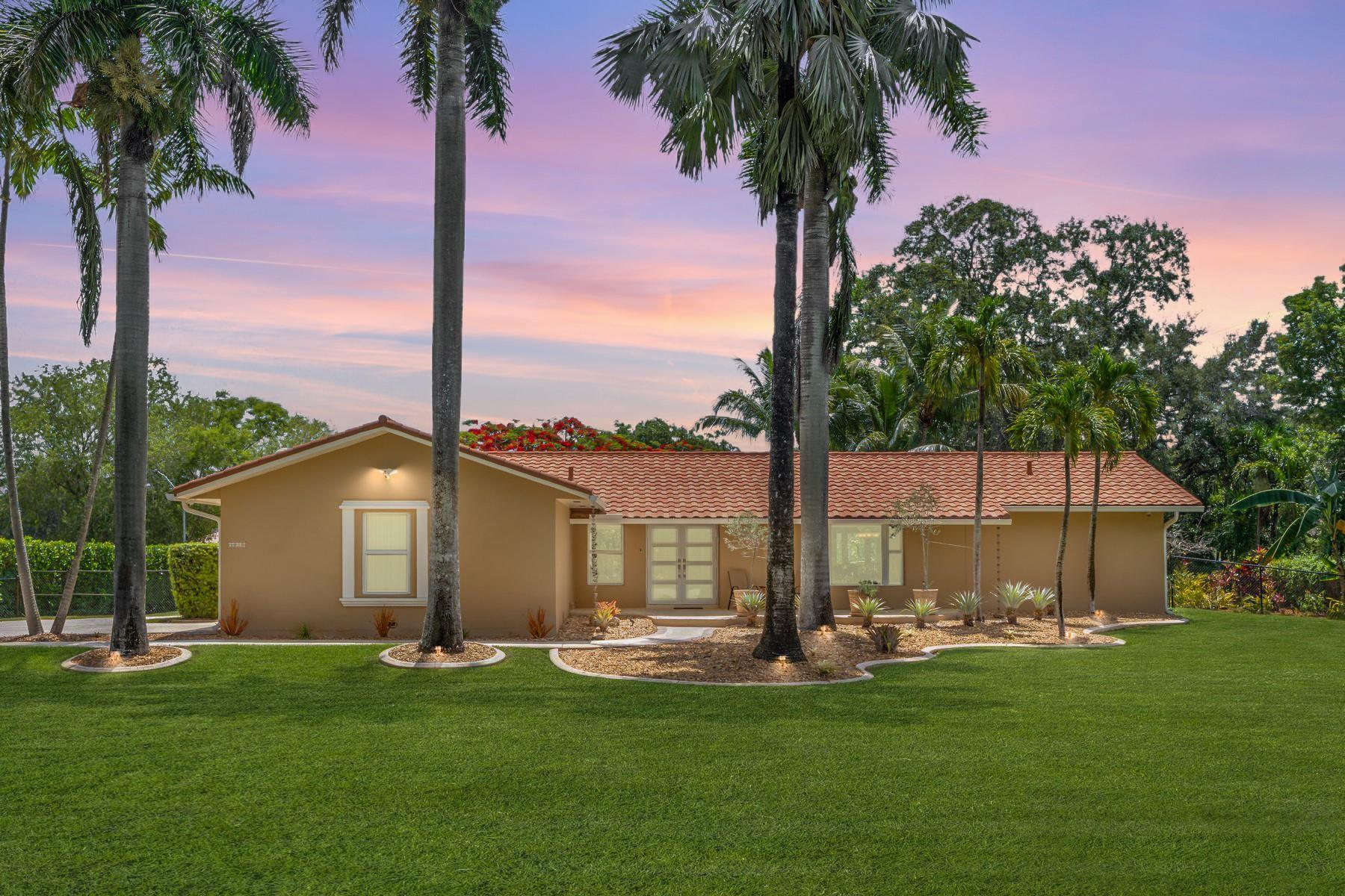 Beautifully updated 3BR/2BA home on a manicured 1-acre canal-front lot. Renovated open concept kitchen with stainless steel appliances. Low maintenance tile flooring throughout. Primary suite features renovated en-suite with double Carrara marble vanity and oversized shower. Custom walk-in closets. Impact windows and doors, underground utilities, and generator transfer switch offer peace of mind. Roof is approx 4 years old, 50-year metal roof with barrel tile look. Two A/C units ensure cool comfort. New septic and drain field 1 year old. Lush yard features mature fruit trees and a canal-fed sprinkler system. Bring the horses, they are allowed with additional outbuilding used as shed, easily convert back to barn. Attached 2-car garage with epoxy flooring and AC. Truly move-in ready!