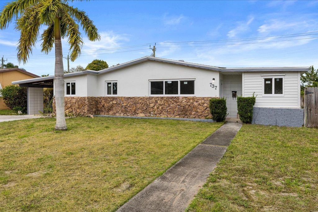 Photo of 737 W Ilex Drive, West Palm Beach, FL 33403 (MLS # B26004632)