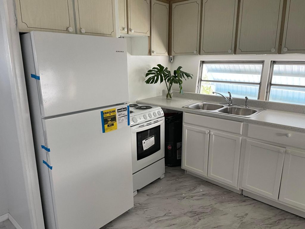 Photo of 2939 Banyan Lane, West Palm Beach, FL 33403 (MLS # B26015100)