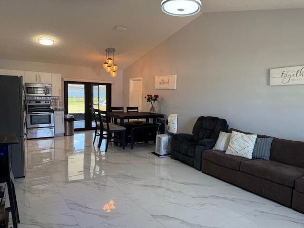 Photo of 1951 SW Agnes Street, Port Saint Lucie, FL 34953 (MLS # R11089393)