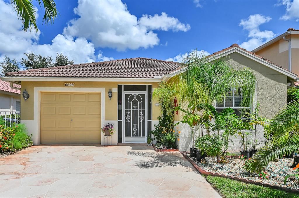 Photo of 6628 Country Winds Cove Cv, Lake Worth Beach, FL 33463 (MLS # R10745881)