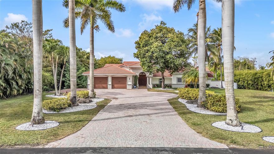 Experience timeless elegance & modern Florida living in this stunning 7 bedroom, 5 bath estate home in the sought after community of Pine Tree Estates, Parkland, FL — with NO HOA! Nestled on a private 1.08-acre lot (143' x 329'), this residence blends Northern charm with the airy feel of South Florida luxury. A manicured lawn, & grand entry way with a large putting green. Enjoy an open kitchen and family room with rich wood cabinetry, top-tier appliances, a large island, and generous space for entertaining. Each of the 7 bedrooms are filled with natural light, featuring custom closets, peaceful pool or garden views, and a warm ambiance. The private backyard is a tropical retreat with a sparkling pool, separate in law / guest house and tons of room for animals. Additional features include: 2-car garage,  All impact windows and doors, Room for a boat, RV, or horse trailer, freedom to live your way. Perfectly located in Pine Tree Estates, Parkland, Florida, this home offers the ideal blend of elegance, privacy, and convenience, just minutes from top-rated schools, shopping, dining, and equestrian trails.Don’t miss this rare opportunity to own one of Parkland’s premier estate homes for sale with acreage and a pool. Schedule your private showing today!