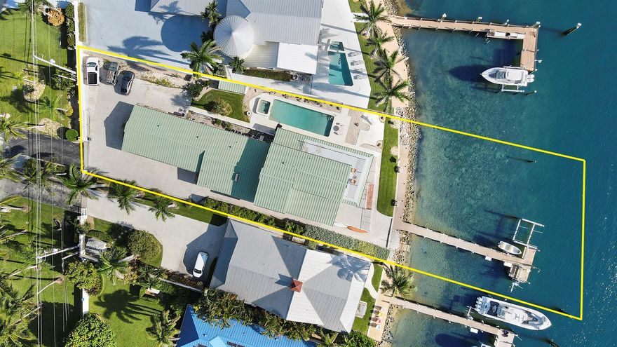 Discover unparalleled waterfront living in this remarkable home, featuring 5 spacious bedrooms, a den, and a separate office with its own entrance. Set against the backdrop of Jupiter Island and the serene Intracoastal Waterway, this property offers both stunning indoor and outdoor vistas.Designed as a blank canvas, this residence presents an exceptional opportunity to personalize and make it your own. Enjoy breathtaking views from both the interior spaces and the expansive first and second-floor patios, perfect for capturing stunning sunsets and ideal for entertaining or relaxing.