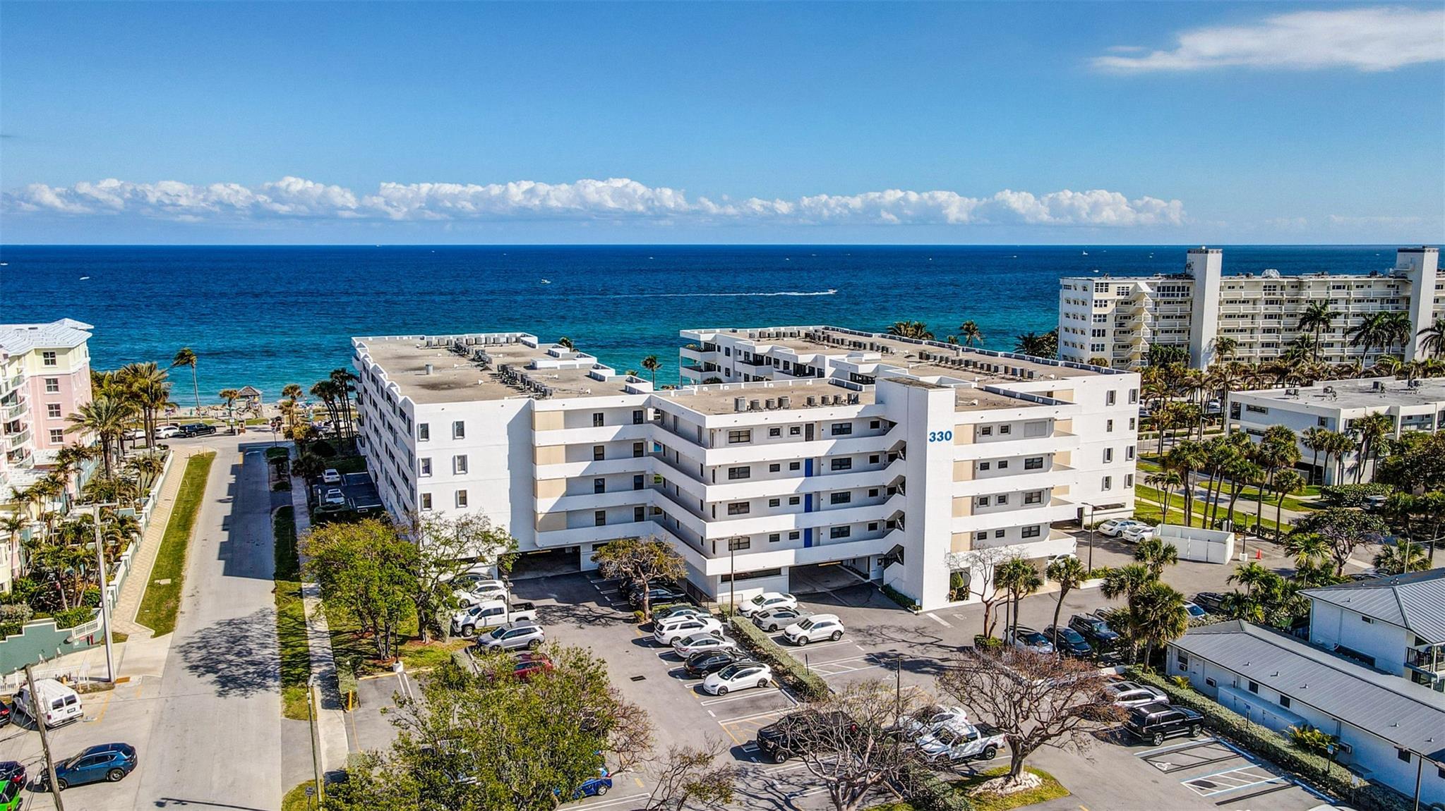 Light & Bright with Expansive Views of Ocean & Pool! This Southeast Exposure 2 Bedroom 2.5 Bath 4th Floor Condo is One in From Direct Corner! Neutral Tile Throughout..Newer Appliances..High Hat lighting..Freshly painted..Building has New Roof & All Concrete work has been Completed and has been Paid for, No upcoming Assessments..Resort Style Living with Large Heated Pool, Hot Tub, Saunas, Barbecue & Community room. Steps to the Beach and Blocks to the New Deerfield Beach International Fishing Pier, Restaurants & Shops! No wait to Rent..One small Pet up to 15 lbs Permitted. Covered Parking Space..