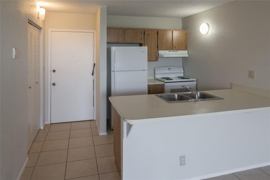 This Full Size (largest) 1 Bedroom 1 Bath unit is located on the top (5th) Floor, so there are no neighbors above. The unit has ceramic tile flooring throughout providing low maintenance living. The refrigerator and range are new, and the unit has just been painted. There is ample storage with 3 closets, one of them being a walk-in. There is a balcony just off of the living room, and the unit comes complete with window treatments. The community offers assigned and guest parking, a key fob-entry system, and the community laundry room is conveniently located just down the hall. Rent INCLUDES water charges.