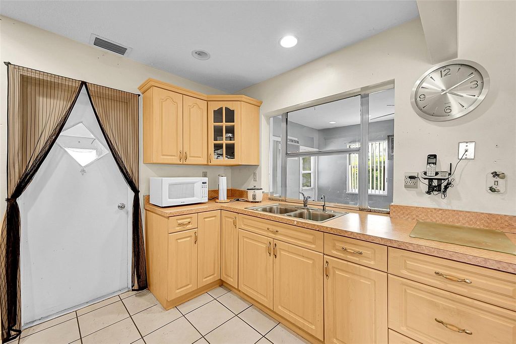 Photo of 8309 NW 59th St, Tamarac, FL 33321 (MLS # F10514947)