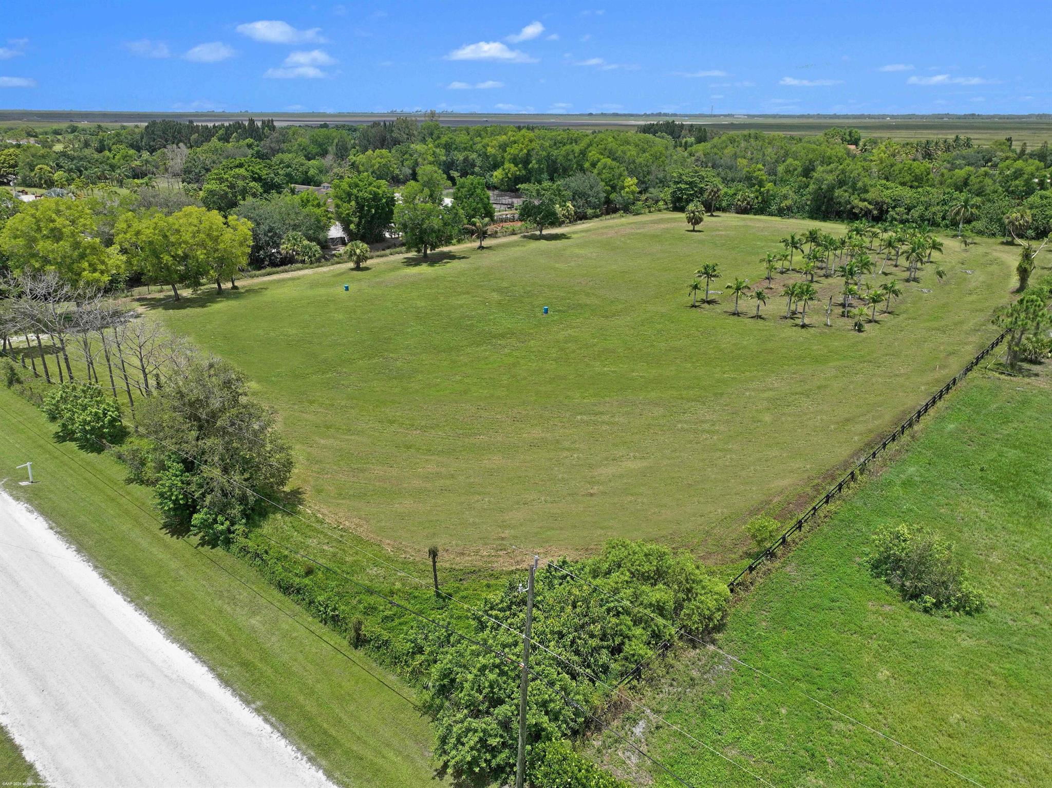 Not much land left in Wellington's horse country! This 5 acre parcel is already significantly improved, partially filled & cleared. Located only a short distance away from the bridle path land bridge to the horse show venues- hack to WEF! Also just a short hack on trails to Wellington's Environmental Preserve - a 365-acre park with nature trails and a 3.6 mile perimeter equestrian trail. One of the last lots available! Ready for construction! City water and electrical available! The desirable equestrian community of Rustic Ranches Estates is conveniently located near shopping and other amenities, yet offers a quiet and private country setting with top rated Wellington schools and city water. Discover why so many professional equestrians are choosing Rustic Ranches.