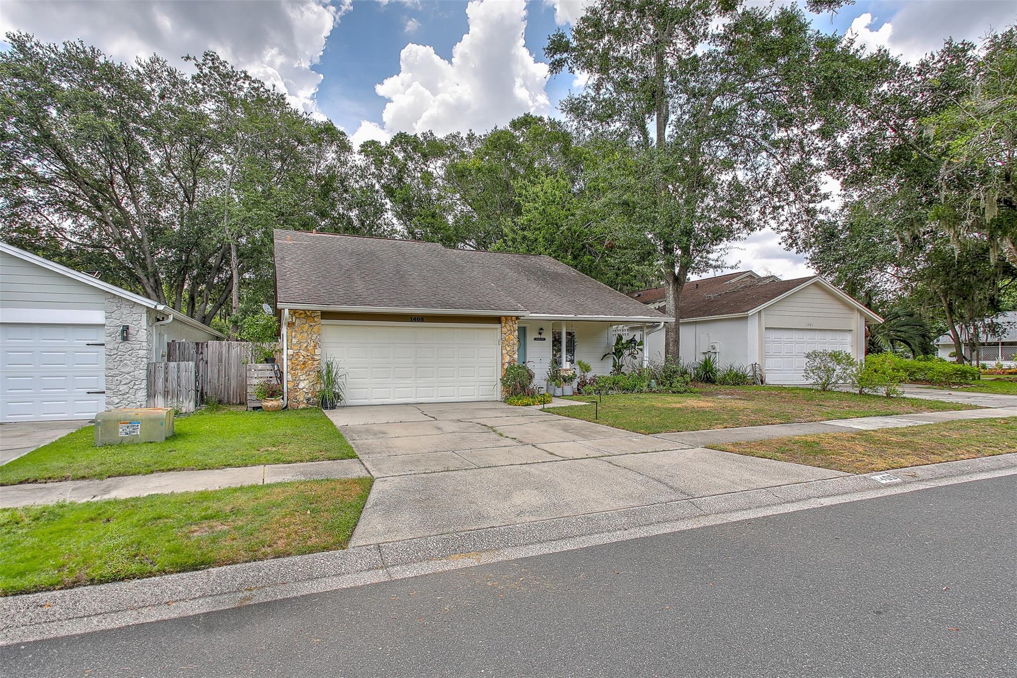 Searching in Winter Park Orlando? Why buy a condo with high maintenance fees when you can buy a 2/2 2 car garage CBS home in Country Lane? A lovely front porch and new roof installed by closing. Pay low association fees $46.33/month ( $556/yearly). This home also features a spacious screened back porch that overlooks a beautiful fully fenced backyard, generous and bright living-dining area connected to the ample kitchen with lots of cabinets and space for a breakfast table all tiled. Spacious carpeted rooms filled with light, generous closets, main room with en suite bathroom, huge vanity, separate shower. Both bedrooms overlook the back screened porch and and yard thru sliding doors. Country Lane community has beautiful lakes, playground & tennis courts. Tenant moving last day of July.