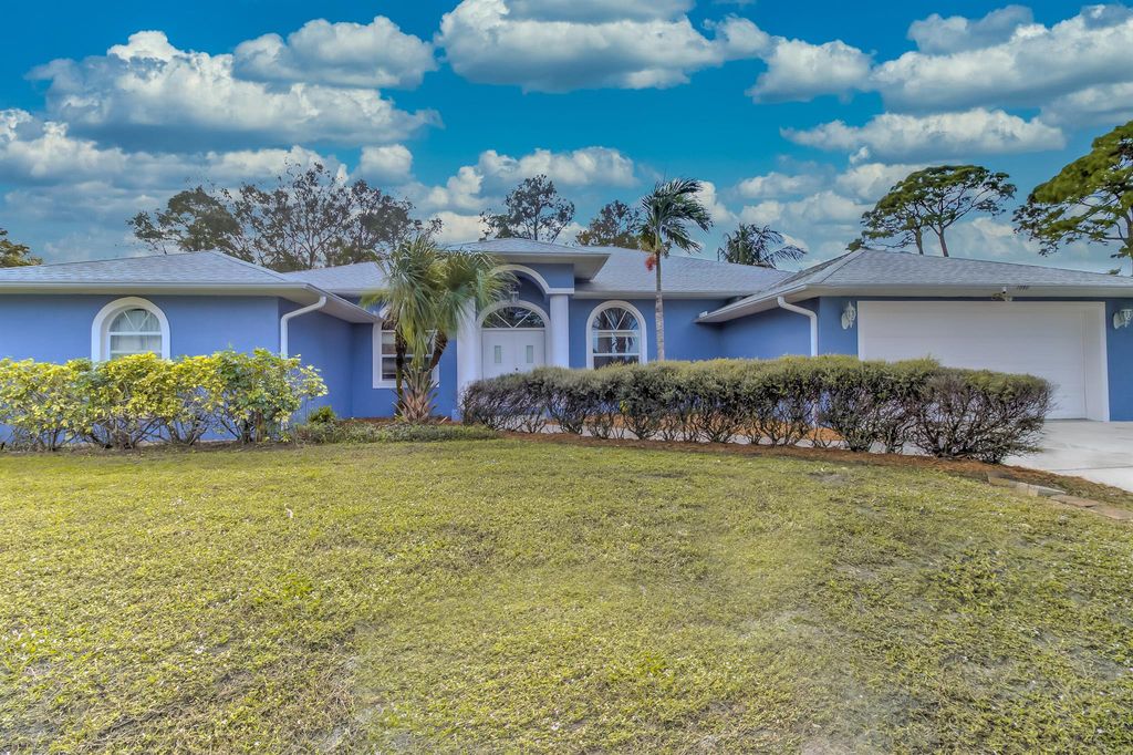 Photo of 1090 SE Shakespeare Avenue, Port Saint Lucie, FL 34983 (MLS # R10943306)