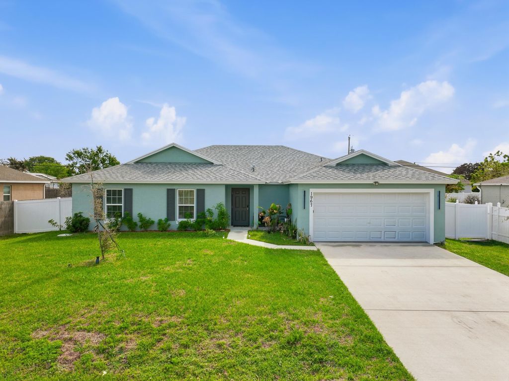 Photo of 1967 SW Beard Street, Port Saint Lucie, FL 34953 (MLS # B26010516)
