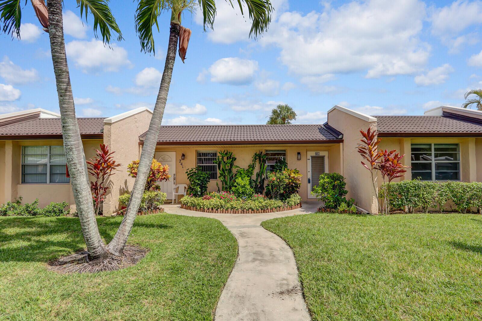 Welcome to your move-in ready villa nestled in the heart of Palm Beach County! This delightful 2-bedroom, 2-bath villa offers a blend of comfort and style with an enclosed patio, full-sized washer and dryer, and tastefully updated kitchen and bath. Enjoy the seamless beauty of tile and laminate flooring throughout.Located in a 24/7 guard-gated community, Golden Lakes Village offers a vibrant lifestyle with a full-time social director that organizes shows, trips, and events. Included in your monthly maintenance are water, Xfinity Comcast Cable with premium channels, and Internet. Enjoy the convenience of a courtesy bus service twice a week for shopping trips to nearby grocery stores, shops, and big-box outlets.The community features a clubhouse pool, hot tub, tennis, pickleball & more