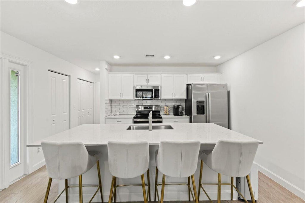 Photo of 6019 Woods Edge Circle, Riviera Beach, FL 33410 (MLS # R11119346)