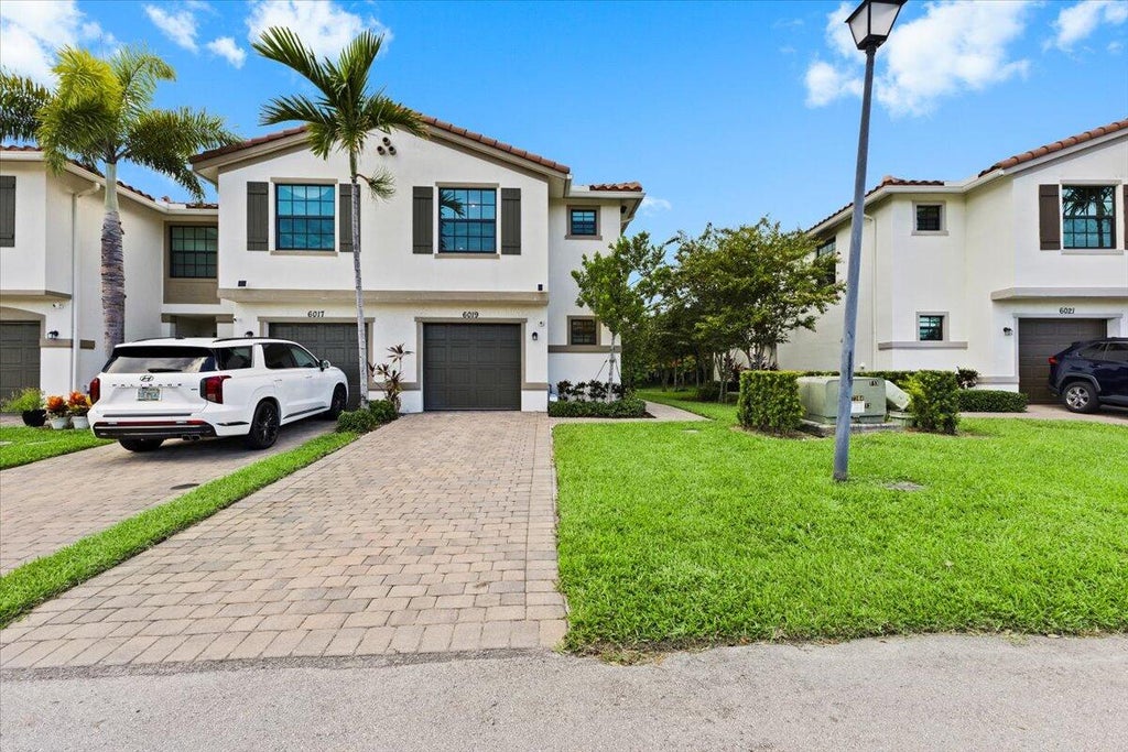 Photo of 6019 Woods Edge Circle, Riviera Beach, FL 33410 (MLS # R11119346)