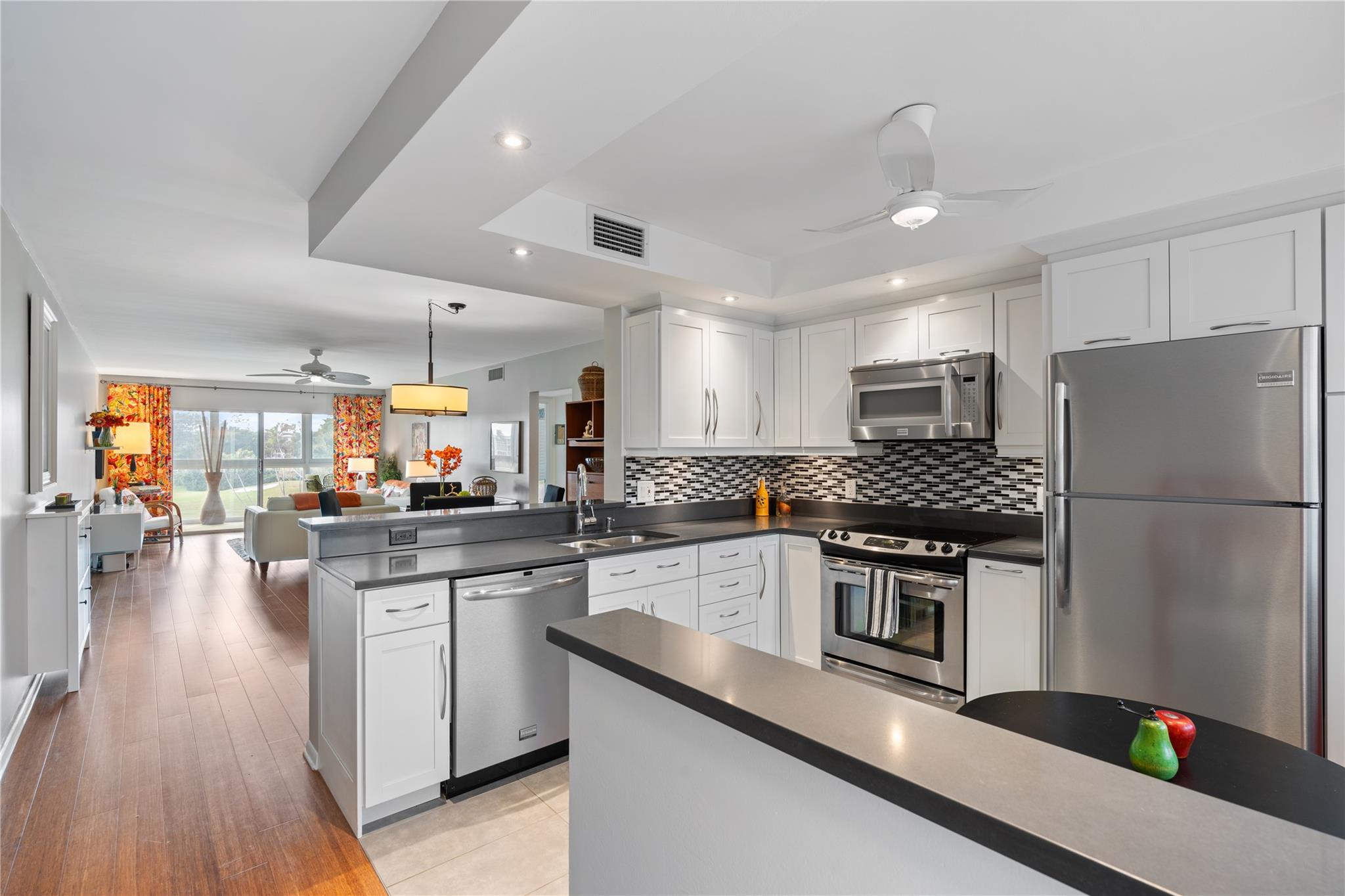 Experience effortless, resort-style living in this fully updated turnkey 2-bed, 2-bath condo, 1,162 sqft. overlooking the golf course and lake in the highly sought-after Wynmoor 55+ community 1 occupant to be 55. This fully furnished home features elegant bamboo floors, impact glass windows, and an open-concept layout that maximizes space and natural light. Enjoy the oversized balcony, perfect for relaxing and taking in the scenic views. The unit also includes a convenient storage unit for added space. Located in a well-maintained building with no assessments, enjoy peace of mind and a hassle-free lifestyle. Whether you're unwinding on your private balcony, or enjoying nearby amenities this condo offers the perfect blend of convenience, style, and tranquility.