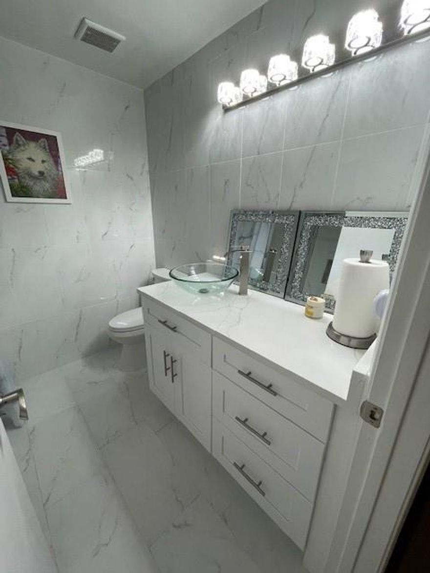 Hurricane High Impact door and Windows, 24hrs gate community, Cable and Internet are included in HOA fees($586)per month, no age restriction, paid Assessment on new roof, new water heater, all baths have been fully remodeled, two cars driveway, multiple guest parking, screened patio