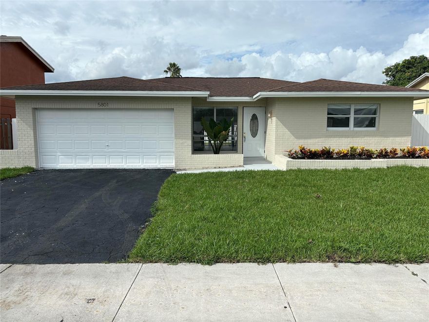 Elegantly updated in Woodland Greens with a flowing floorplan.  Generously sized house with a beautiful kitchen.  Let the pictures speak for themselves.   Coming soon the city will have a wall built for privacy from Commercial Boulevard.    Construction has already started across the street.  Excellent neighborhood, centrally located.