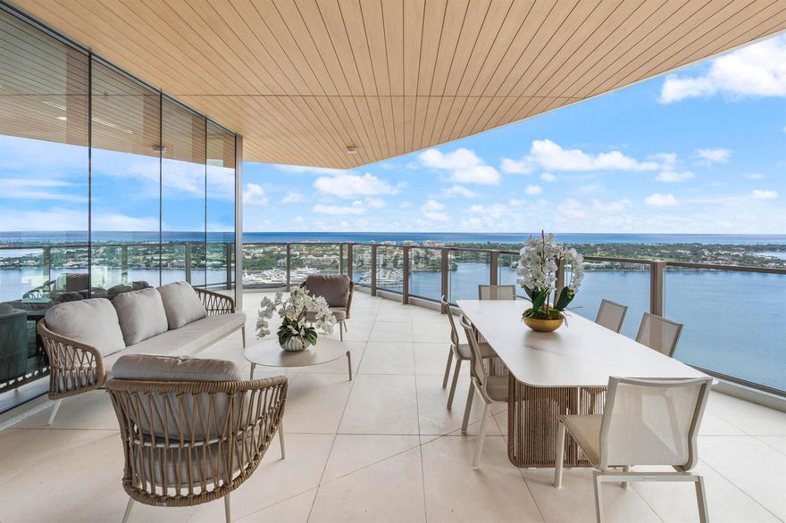 BRAND NEW WATERFRONT! The ONLY residence in the building to have TWO separate full baths each finished with Taj Mahal stone in the primary bedroom. Experience sweeping views of Palm Beach, the Intracoastal, and the Atlantic Ocean from Residence 2002 at Forte on Flagler. This NEW custom flow-through residence offers 4,440 sq ft of refined living with floor-to-ceiling windows and an expansive wrap-around terrace that creates seamless indoor-outdoor living. The spacious main living area features an open floor plan and a custom wet bar; an elegant focal point designed for effortless entertaining. The gourmet kitchen showcases premium appliances, a sculptural island, and custom cabinetry. Three additional en-suite bedrooms provide comfort and flexibility for guests, work, or wellness. Forte on