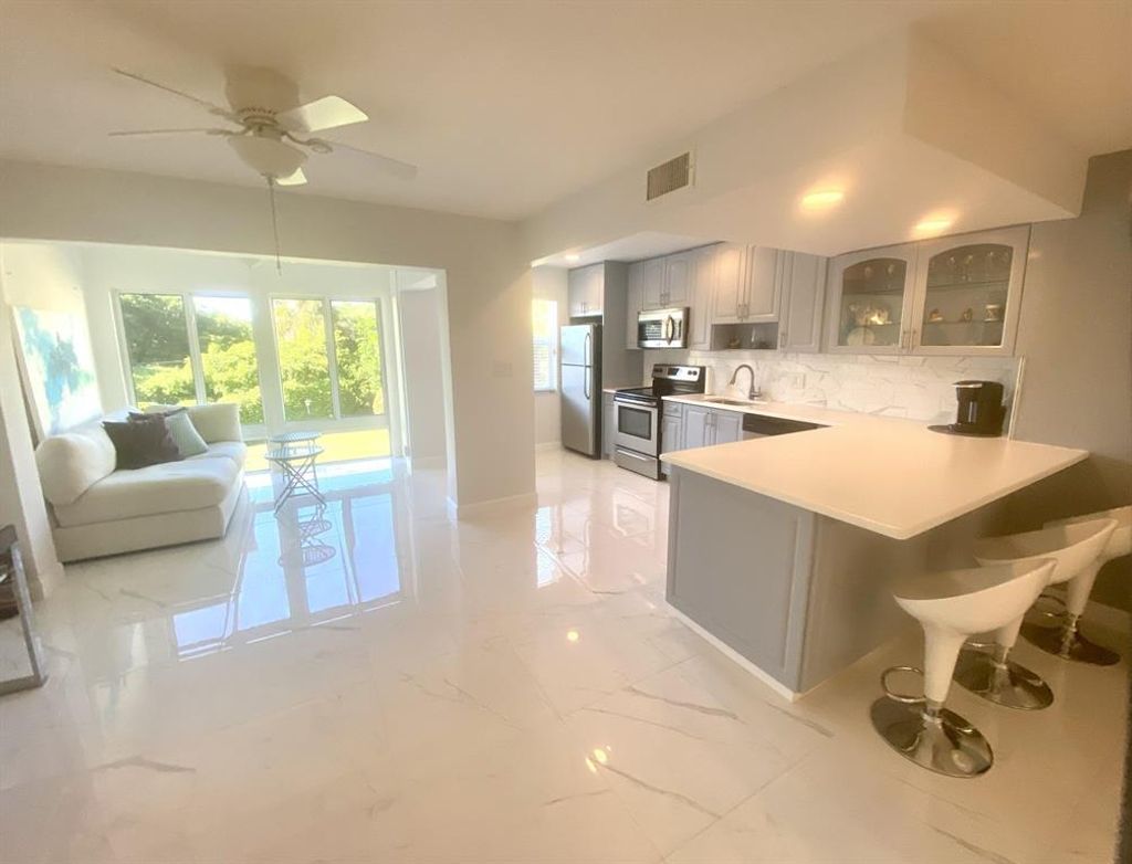 Photo of 21 Colonial Club Drive #203, Boynton Beach, FL 33435 (MLS # R10823203)