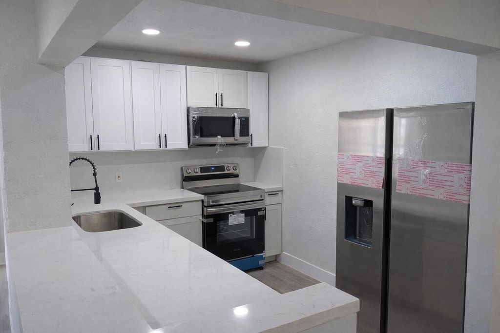 Photo of 2613 SW Natura Avenue, Deerfield Beach, FL 33441 (MLS # B26006499)