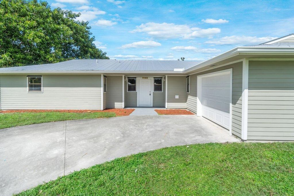 Photo of 7106 Pensacola Road, Fort Pierce, FL 34951 (MLS # R10931186)