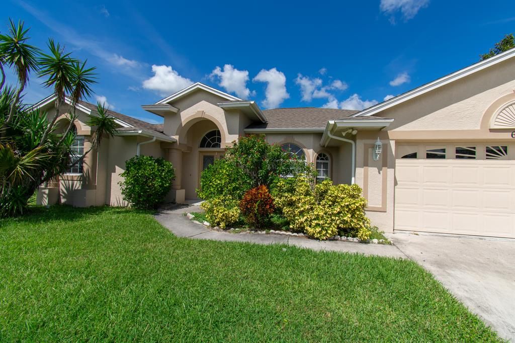 Photo of 6013 NW Wolverine Road, Port Saint Lucie, FL 34986 (MLS # R10771270)