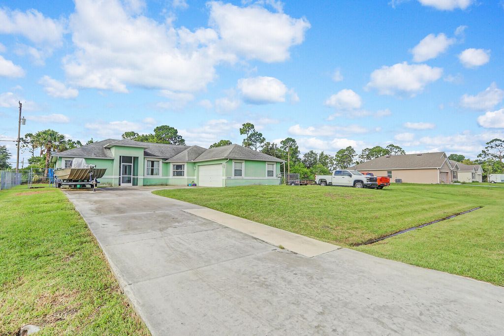 Photo of 1066 SW Calmar Avenue, Port Saint Lucie, FL 34953 (MLS # R11002283)