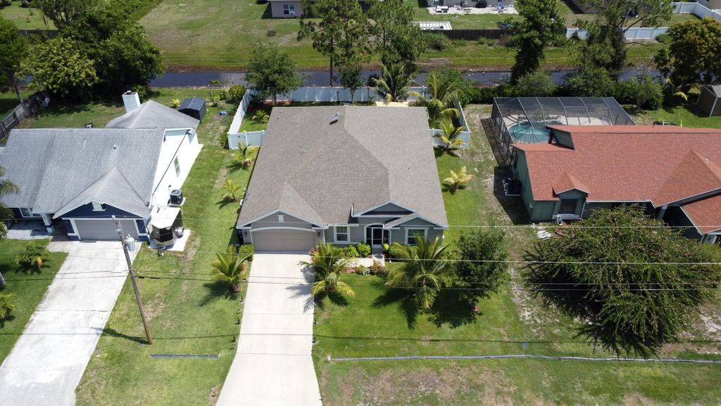 Photo of 443 SW Dahled Avenue, Port Saint Lucie, FL 34953 (MLS # R10992632)
