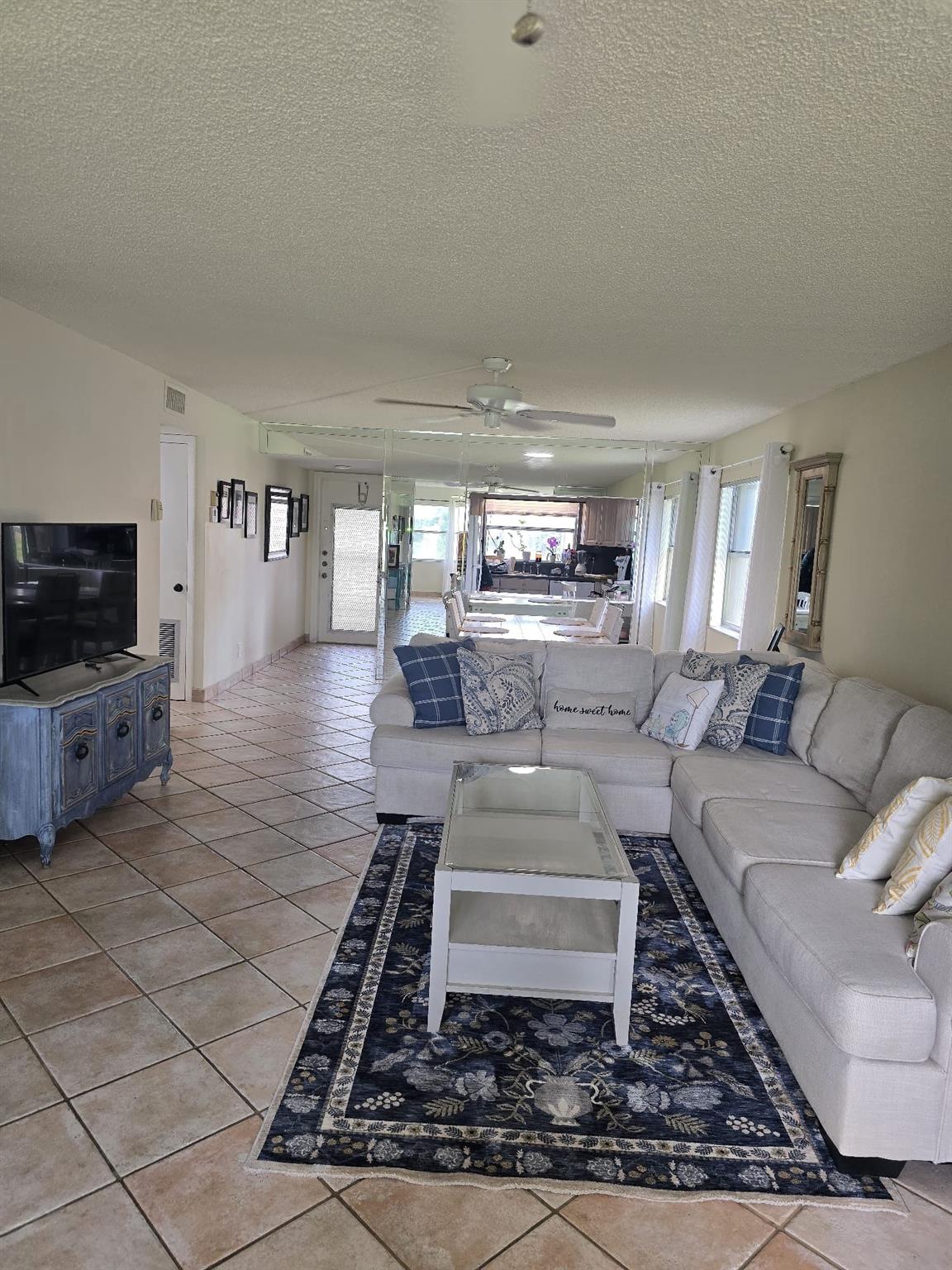 Beautiful 2br/2bath corner unit condo in sunrise lakes phase 3 with over 1100sqft of living space with a Florida room that can be used as an office/den. This unit is ready to move in with new kitchen appliances, wood kitchen cabinets, eat in kitchen, pull out cabinet drawers, tile floors, accordion shutters all around -and has a nice open floor plan with amazing vies of the lake and golf from the property. Community is 55 plus with a beautiful clubhouse, tennis, courtesy bus, billiards, indoor heated pool, 5 satellite pools throughout the community, fitness room and more. A storage unit on the same floor. his location is close to shopping and sawgrass mills mall. The Property will be sold if needed with the Living room and dining room.