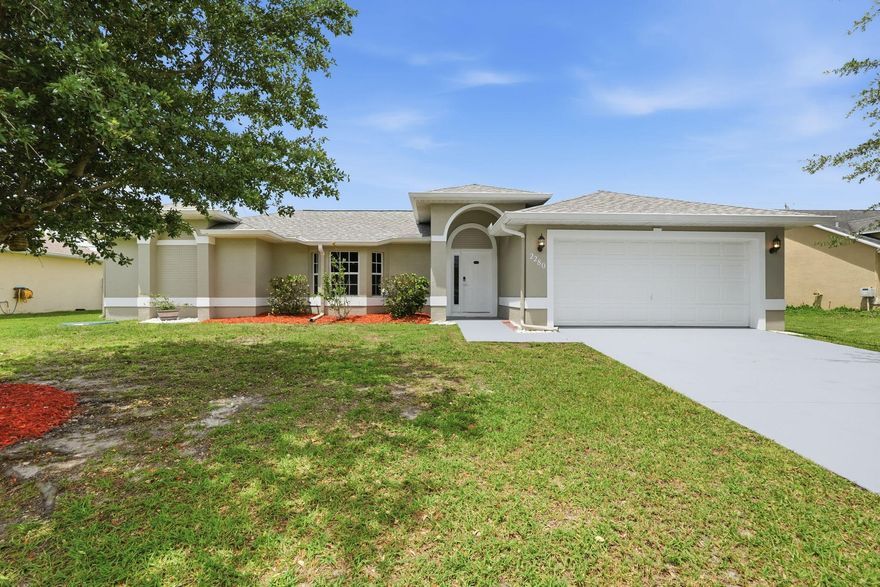 Beautifully updated 3BR/2.5BA/2-car garage home in Port St. Lucie, conveniently located near major highways, shopping, and dining. This move-in ready home features new flooring, fresh interior paint, new blinds, and updated vanity mirrors. The upgraded kitchen boasts granite countertops, backsplash, soft-close cabinets and drawers, and a brand-new refrigerator. Major updates include a new roof (2024), new A/C (2026), and new water heater (2026). Additional features include tinted windows and new hurricane shutter panels. Enjoy a huge, fully fenced backyard perfect for entertaining.  A must-see!