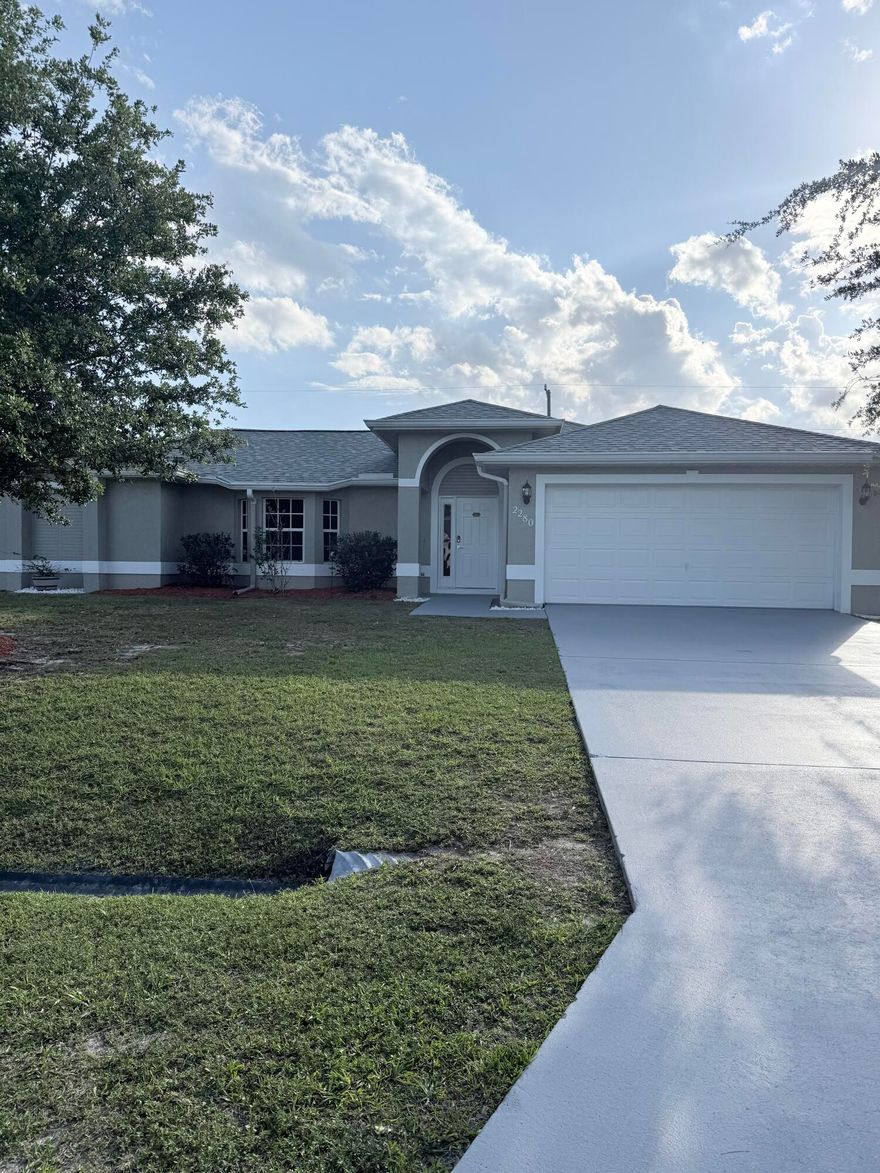 Beautifully updated 3BR/2.5BA/2-car garage home in Port St. Lucie, conveniently located near major highways, shopping, and dining. This move-in ready home features new flooring, fresh interior paint, new blinds, and updated vanity mirrors. The upgraded kitchen boasts granite countertops, backsplash, soft-close cabinets and drawers, and a brand-new refrigerator. Major updates include a new roof (2024), new A/C (2026), and new water heater (2026). Additional features include tinted windows and new hurricane shutter panels. Enjoy a huge, fully fenced backyard perfect for entertaining.  A must-see!