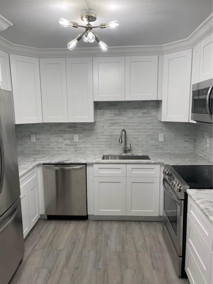 Beautiful Completely Remodeled Condominium for Rent in West Boca Raton Sandalfoot Community on First Floor. This condominium was completely remodeled 3 years ago. It has new flooring, 2 new bathrooms, new kitchen and new appliances, new washer and dryer. Everything New!! This condominium is located right next to the pool. Cable and water included. There is a $375 Application Fee for the Condominium Association. Yearly lease. First, Last and security is required down payment. No Pets. Currently Available.
