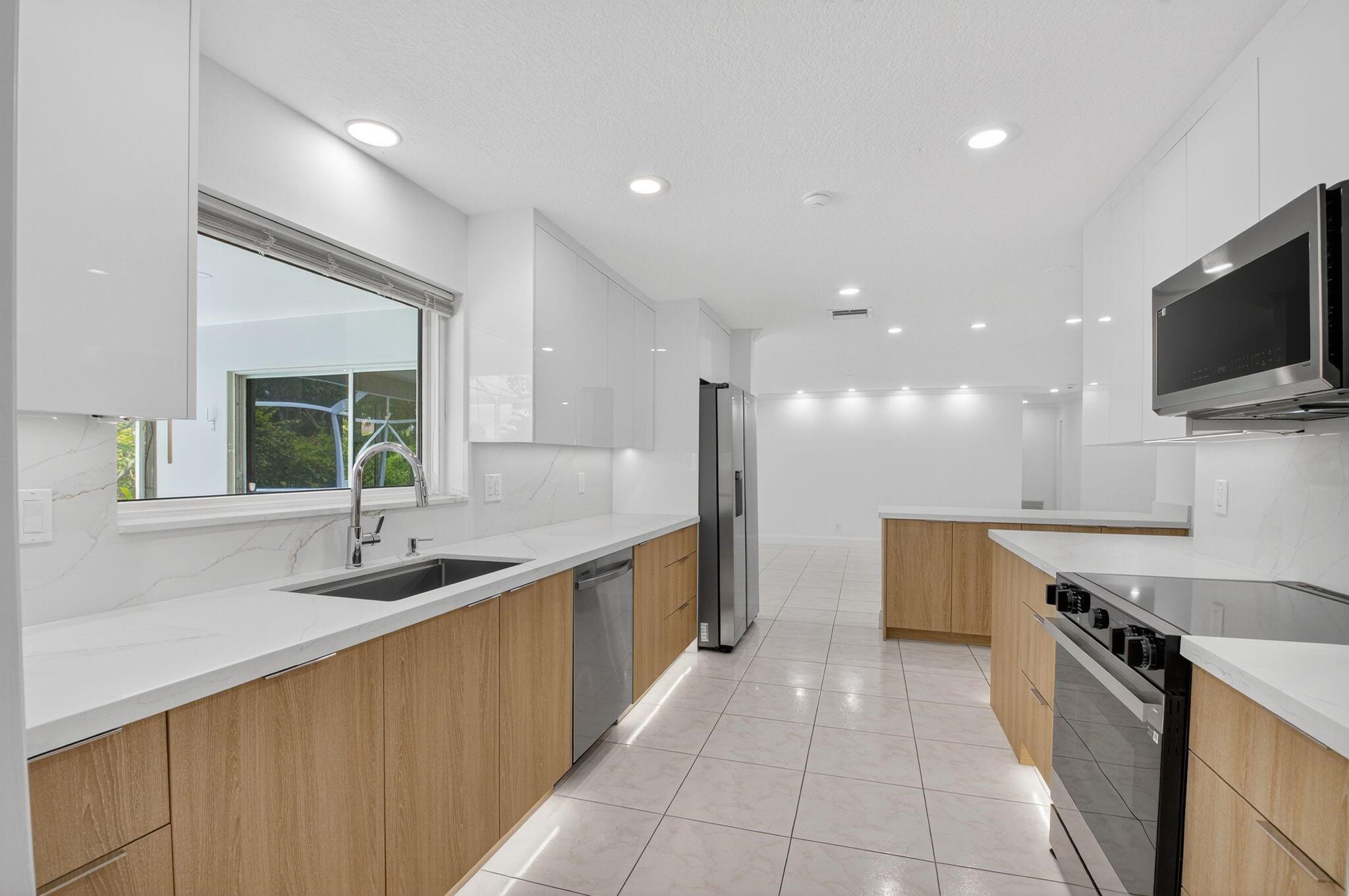 Gorgeous single family pool home in the heart of Delray! Property features 4 spacious bedrooms + a bonus room (5th bedroom/office). Fully upgraded, brand new kitchen w/ custom cabinets, new appliances, wine cooler & beautiful Quartz countertops. Brand new bathrooms, custom LED lighting all throughout the home, ideal walk-in closet in master bedroom w/ custom powder room. This home literally offers the perfect blend of luxury, convenience and privacy. 1 Car garage plus oversized driveway, hurricane impact windows, fully screened-in lanai with room for BBQ - Ideal for entertainment and summer vibes all year round. Gorgeous landscaping surround's the pool area offering full privacy and relaxation. LAWN, POOL MAINTENANCE AND WATER INCLUDED. NO HOA. Pets are welcome. Call today for more info!