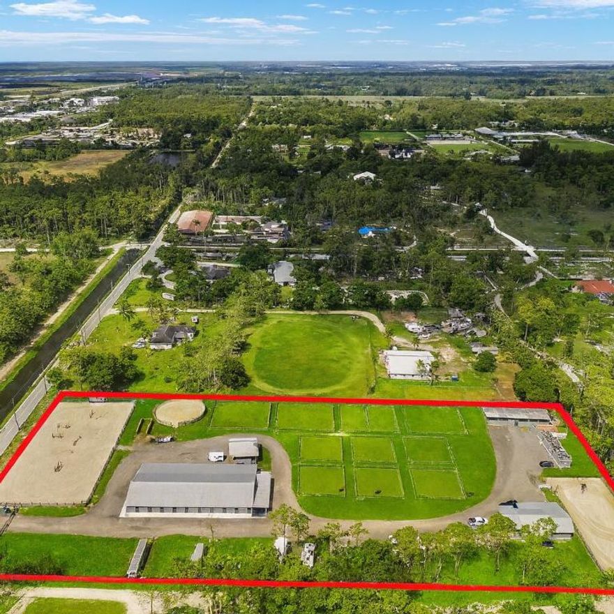 Fully renovated, specialty commercial equestrian facility offering strong in-place income with significant upside. Cash-flowing equestrian farm off Southern Blvd, set on 5 elevated acres in the heart of Loxahatchee Groves, just minutes from Wellington. The property offers 53 stalls across two updated barns, 16 fenced pastures, two riding arenas, a round pen, three RV spots, and generous trailer parking. On-site housing includes a 3-bed, 2-bath cabin and two mobile homes. Current operations deliver a ~7.7% in-place cap at the asking price, with a clear path to mid-to-high teens stabilized returns through lease-up and full utilization of existing assets. Short hack to new equestrian riding trails. Ride your golf cart to shopping and restaurants. Fully licensed as a rental operation
