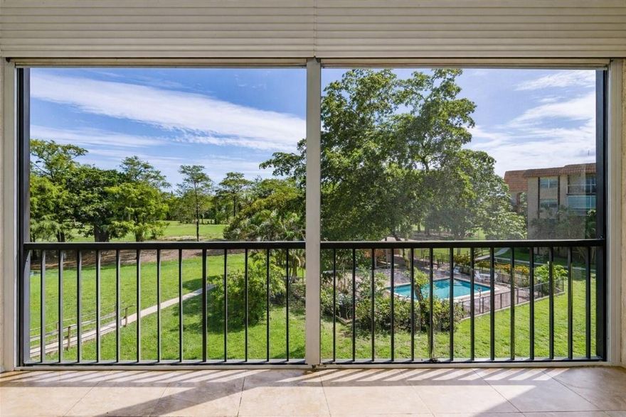 This condominium features updates completed in 2022, stainless steel kitchen appliances (French door refrigerator, range, and microwave), interior paint, flooring, and LED lighting throughout. The kitchen includes custom cabinetry, a pantry, and granite countertops. Both bedrooms have walk-in closets, with an additional closet in Bedroom 1. The unit includes on-site storage. A screened, tiled patio overlooks the pool.

Association dues include internet, cable, trash, water, and contributions to reserves. The community offers a 24-hour guard-gated entrance and laundry facilities on every level.