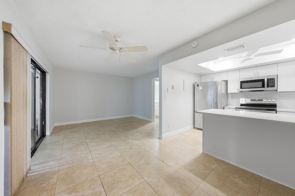 Photo of 52 Canterbury Lane, Tamarac, FL 33319 (MLS # B26051147)