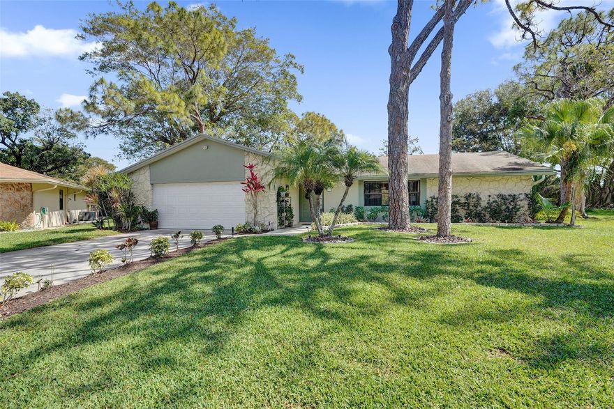 Live where amenities and affordability meet! This beautifully remodeled 2-bedroom, 2-bathroom residence offers the perfect blend of modern upgrades and comfortable living. Completely remodeled chef's kitchen features sleek quartz countertops, Water-fall island, modern gloss cabinets, mosaic glass backsplash, and newer SS appliances. The entire house has wood look flooring, high-hat lighting, designer ceiling fans, and elegant crown molding throughout. Both bathrooms have been completely renovated with contemporary showers and tile. The master bedroom features a walk-in closet w/custom California shelving.  This home sits on a massive 15,400sf lot offering a serene and private setting perfect for play area and plenty of room for a pool. Rainberry Bay is a 55+ Active Adult community. Rainberry Bay is a vibrant 55+ community with fantastic amenities including; a clubhouse, 5 pools, theater, fitness center, Bocci ball, pickleball, tennis courts, game room, library, and on-site management.  The monthly association fee includes cable TV, common area maintenance, security, pest control, roof repairs/replace, exterior stucco and paint, pressure cleaning and reserve fund.