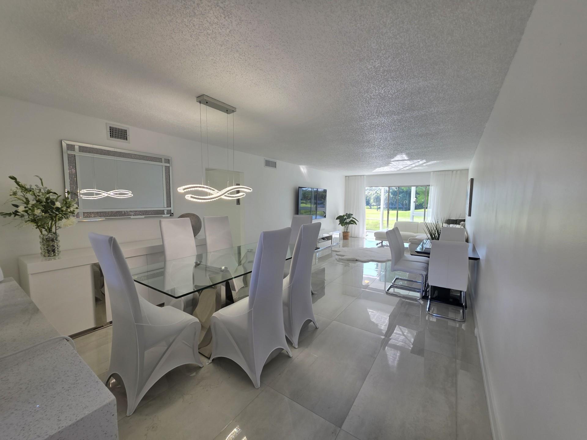 STUNNINGLY REMODELED 2BR/2BA CONDO, REIMAGINED WITH NO EXPENSE SPARED. FEATURING IMPECCABLE TASTE, DESIGNER FINISHES, AND TOP-OF-THE-LINE MATERIALS THROUGHOUT. HIGH IMPACT WINDOWS AND DOOR. BRAND NEW, HIGH-END FURNITURE IS ALSO AVAILABLE AND NEGOTIABLE. THE TOTAL VALUE OF UPGRADES AND DESIGN FAR EXCEEDS THE ASKING PRICE — AN INCREDIBLE OPPORTUNITY FOR DISCERNING BUYERS. COMMUNITY BOAST NUMEROUS SWIMMIMG POOLS, PICKLEBALL, TENNIS, SHUFFLE COURTS AND 18 HOLE GOLF COURSE, FITNESS CENTER, THEATER, GATED COMMUNITY. ENJOY NUMEROUS EXCITING ACTIVITIES IN WYNMOOR 55+. EXTRA STORAGE COMES WITH 2 LOCKERS; THIS IS A UNIQUE CHANCE TO OWN A DESIGNER CONDO AT A VALUE. READY TO MOVE IN, HURRY UP!