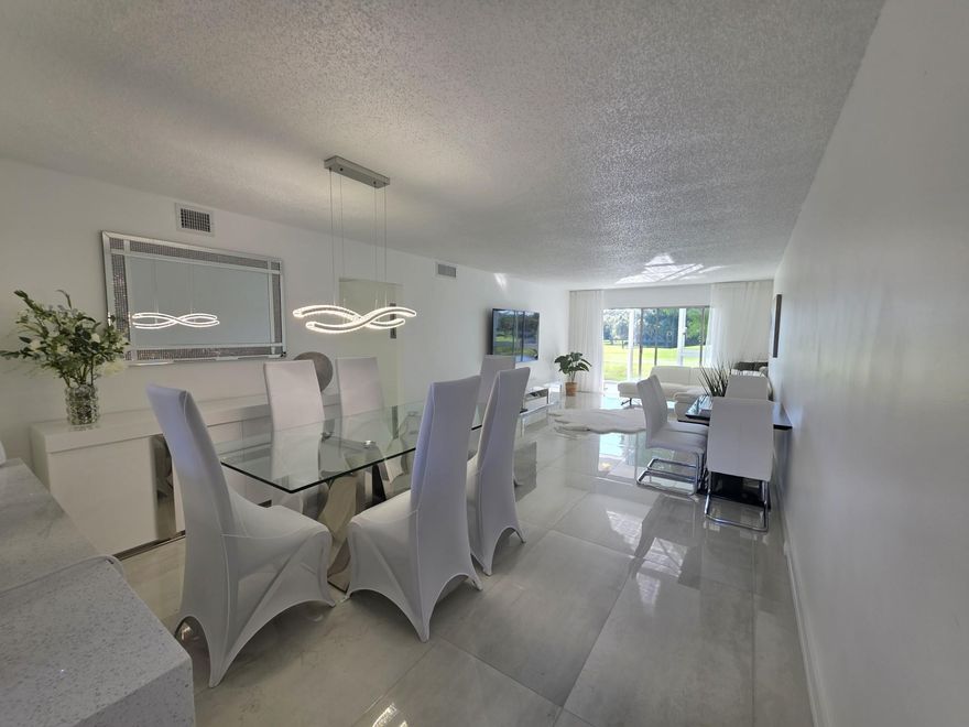 STUNNINGLY REMODELED 2BR/2BA CONDO, REIMAGINED WITH NO EXPENSE SPARED. FEATURING IMPECCABLE TASTE, DESIGNER FINISHES, AND TOP-OF-THE-LINE MATERIALS THROUGHOUT. HIGH IMPACT WINDOWS AND DOOR. BRAND NEW, HIGH-END FURNITURE IS ALSO AVAILABLE AND NEGOTIABLE. THE TOTAL VALUE OF UPGRADES AND DESIGN FAR EXCEEDS THE ASKING PRICE — AN INCREDIBLE OPPORTUNITY FOR DISCERNING BUYERS. COMMUNITY BOAST NUMEROUS SWIMMIMG POOLS, PICKLEBALL, TENNIS, SHUFFLE COURTS AND 18 HOLE GOLF COURSE, FITNESS CENTER, THEATER, GATED COMMUNITY. ENJOY NUMEROUS EXCITING ACTIVITIES IN WYNMOOR 55+. EXTRA STORAGE COMES WITH 2 LOCKERS; THIS IS A UNIQUE CHANCE TO OWN A DESIGNER CONDO AT A VALUE. READY TO MOVE IN, HURRY UP!