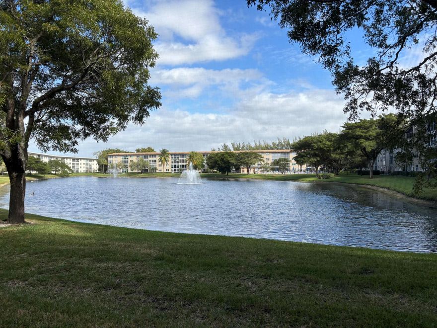 Wow, what a view! This 2-bedroom, 2-bath deluxe ground-floor condo in a gated community features a screened patio with stunning views of the lake, fountain, and pool. Enjoy an eat-in kitchen a washer/dryer in unit, walk-in closet in the primary bedroom, and extra storage. Located in Wynmoor, an active adult community boasting a 50,000 sq. ft. clubhouse, cafA(c), 19 pools, walking pool, Jacuzzi, tennis, pickleball, fitness center, theater, billiards, art classes, over 80 clubs, and an 18-hole golf course. Discover the vibrant lifestyle Wynmoor offer, it's more than a home, it's a lifestyle!