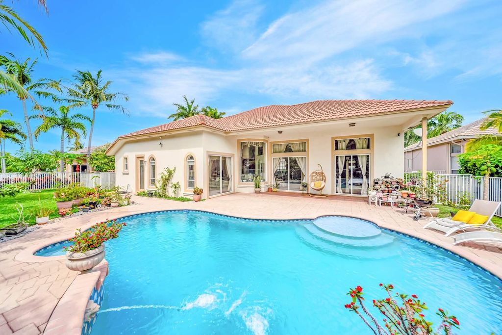 Photo of 6169 NW 53rd Circle, Coral Springs, FL 33067 (MLS # B26015473)