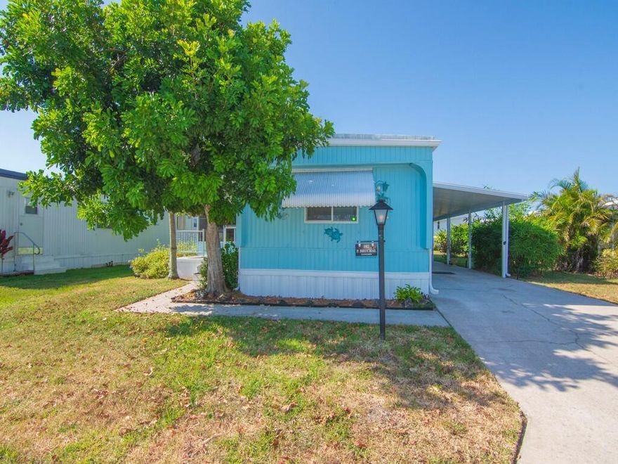 This 2/2 mobile home located in the 55+ community of Pinelake Village in Jensen Beach has a cute beachy vibe that makes for a great getaway or a perfect retirement home.  The kitchen and bathrooms have been totally remodeled and it has a new A/C unit and new washer and dryer, new flooring throughout, and a large screened in patio.   The roof has a lifetime warranty, vapor barriers to keep your crawl space dry are intact and it also has double tie-downs.  Lot rent is only $765 per month and includes cable, trash removal, recycling and all the amenities of the clubhouse.  Conveniently located close to downtown Jensen Beach for shopping, dining, and the beaches.