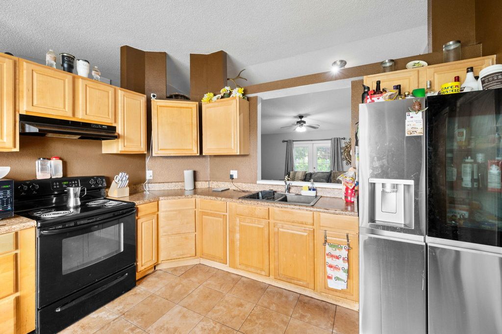 Photo of 661 NW Kildare Street, Port Saint Lucie, FL 34983 (MLS # B26014121)