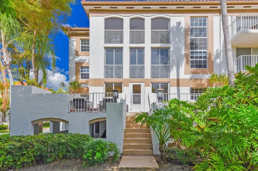 Bathe yourself in Light in this spacious 1st-floor unit offering 1,913 sq ft of thoughtfully designed living space. This 3-bdrm, 2.5-bath condo features light maple real wood floors thru-out the main living areas, open & bright living & family rooms w/ serene golf course views & a lighted bar & expansive dining room, perfect for entertaining. The kitchen showcases rich wood cabinetry w/ modern hardware, high-grade stainless-steel appliances.. The primary suite offers a walk-in closet, golf views, & a spa-style bath. 2 equally sized guest bedrooms-1 w/ built-in office-share a full bath & private balcony. The wraparound balcony & patio provide lush golf course views. Complete w/ designer lighting, full washer & dryer in the unit, & covered parking this unit exudes style & functionality. Boca Grove offers top security, championship golf courses, active tennis program, pickle ball, basketball, state of the art fitness center, w/ scheduled classes and private trainers, snack bar, resort style pools, casual & fine dining w/ world class, award winning chef. Centrally located - easily enjoy shopping, dining, beaches, and more!